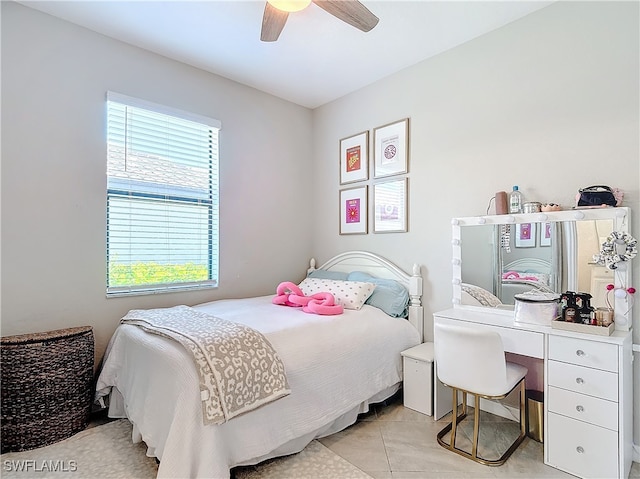 bedroom featuring light tile patterned floors and ceiling fan