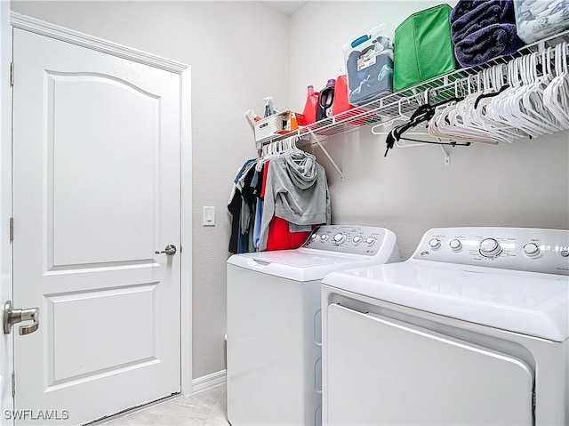 washroom with independent washer and dryer