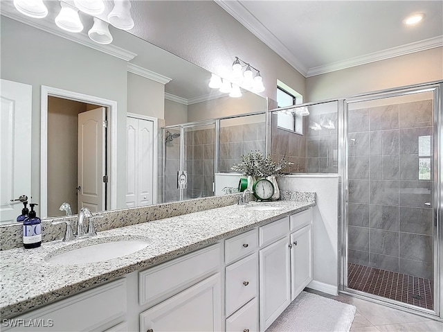 bathroom with ornamental molding, vanity, tile patterned floors, and a shower with door