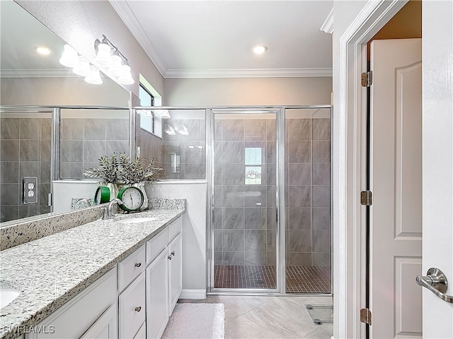 bathroom featuring vanity, an enclosed shower, and ornamental molding