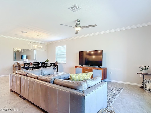 tiled living room featuring ornamental molding and ceiling fan with notable chandelier