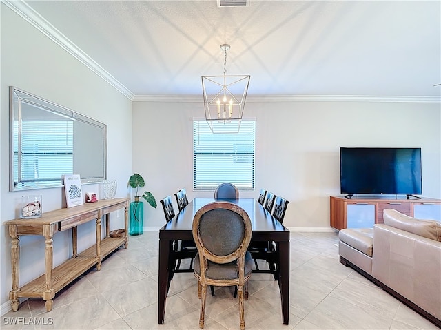 tiled dining space with plenty of natural light, a notable chandelier, and crown molding