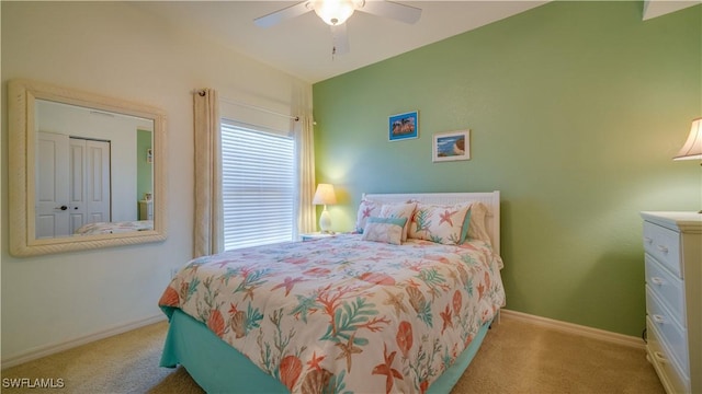 bedroom featuring ceiling fan and light carpet