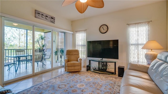 tiled living room featuring ceiling fan