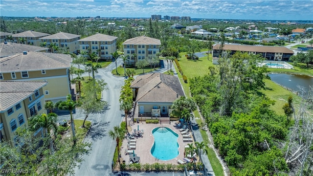 birds eye view of property with a water view