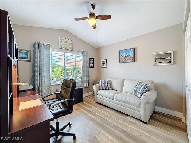 office area featuring vaulted ceiling, ceiling fan, and light wood-type flooring