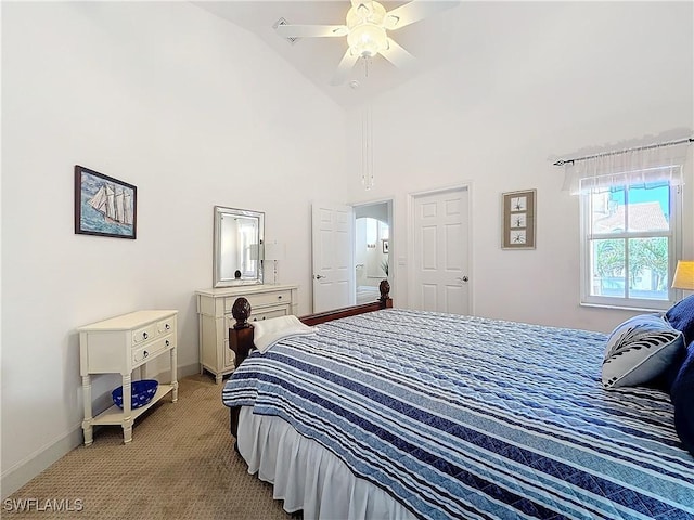 bedroom featuring ceiling fan, carpet floors, and high vaulted ceiling