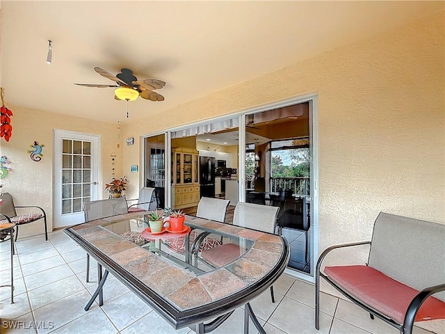 view of patio featuring ceiling fan