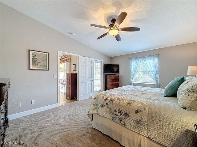 bedroom featuring lofted ceiling, carpet floors, and ceiling fan