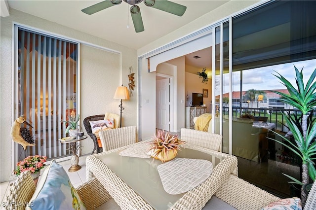 sunroom / solarium with ceiling fan