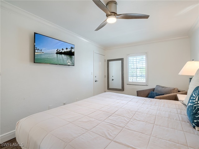 bedroom with ornamental molding and ceiling fan