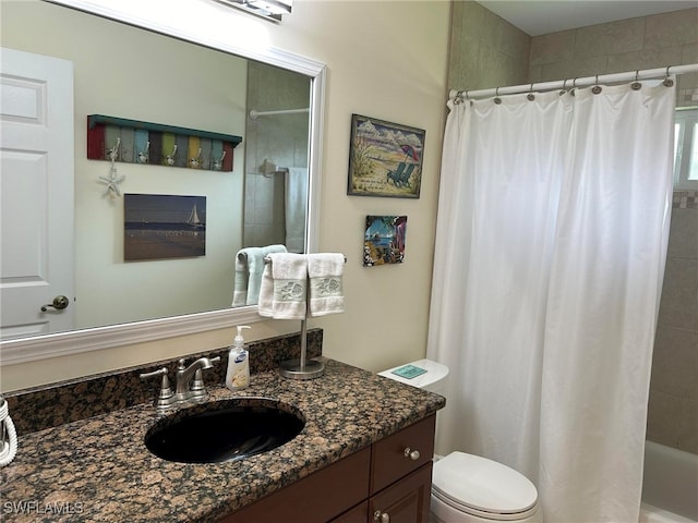 full bathroom with toilet, shower / bath combo, and vanity