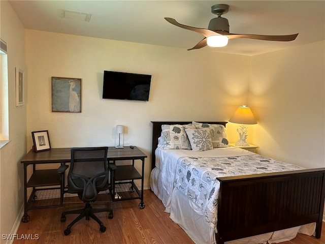 bedroom featuring ceiling fan and hardwood / wood-style flooring
