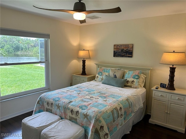 bedroom featuring ceiling fan and dark hardwood / wood-style flooring