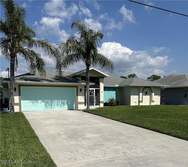 view of front facade featuring a front yard and a garage