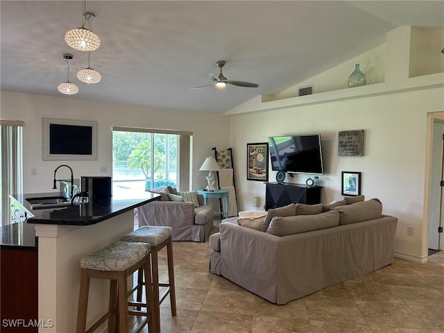 tiled living room with lofted ceiling, sink, and ceiling fan