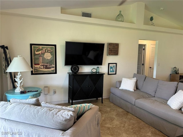 living room featuring lofted ceiling
