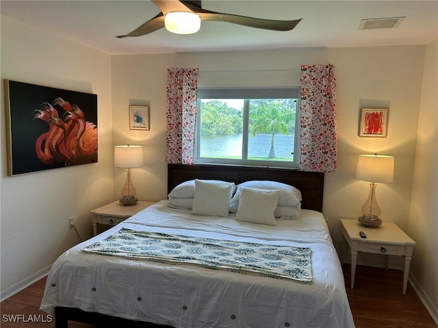 bedroom with wood-type flooring and ceiling fan