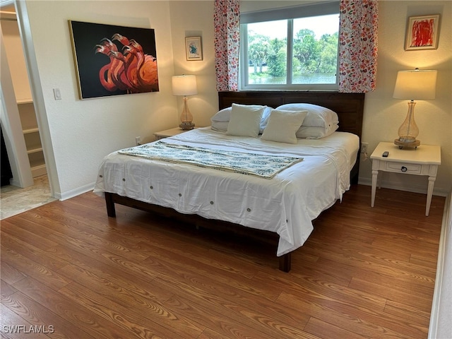 bedroom featuring hardwood / wood-style flooring