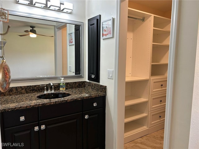bathroom with vanity, wood-type flooring, and ceiling fan