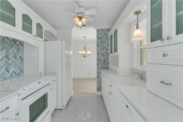 kitchen featuring white appliances, white cabinetry, sink, and pendant lighting