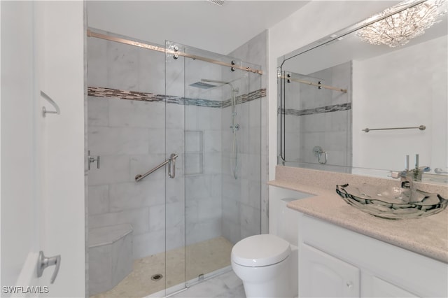 bathroom with vanity, toilet, and an enclosed shower