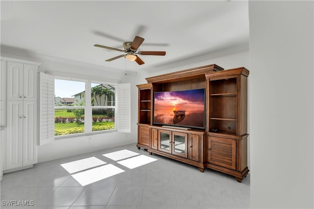 unfurnished living room featuring ceiling fan and crown molding