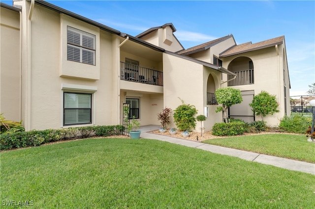 view of property with a front lawn