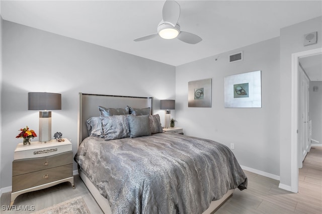 bedroom featuring light hardwood / wood-style flooring and ceiling fan