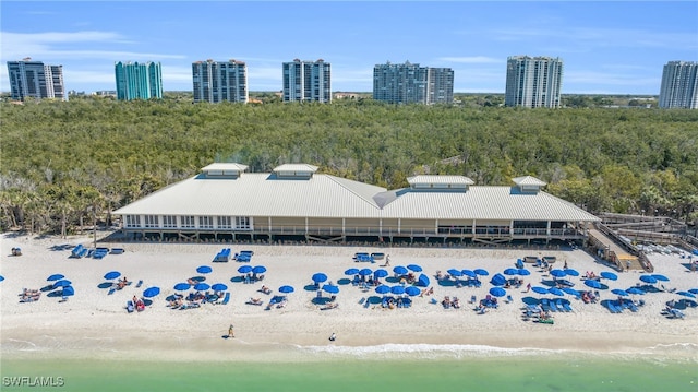 bird's eye view featuring a water view and a view of the beach