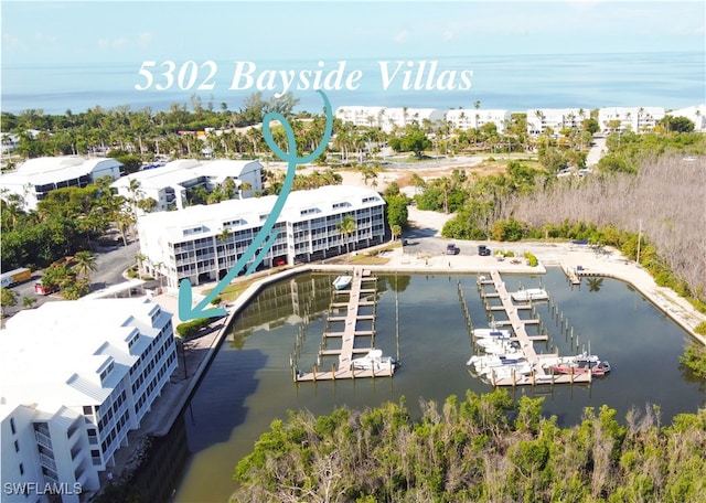 birds eye view of property featuring a water view