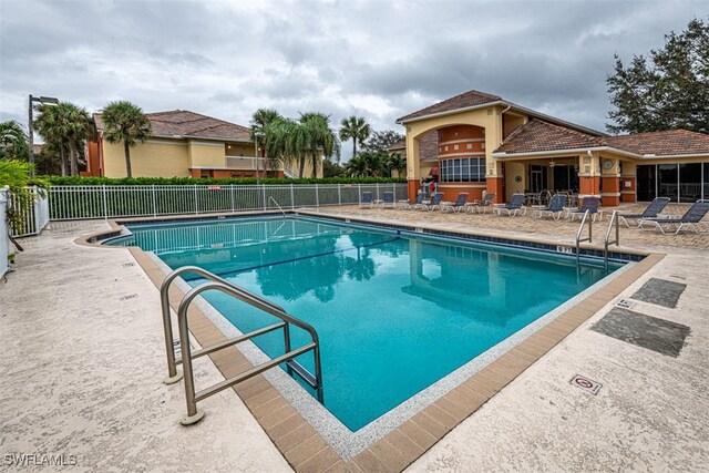 view of pool featuring a patio