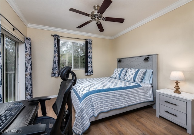 bedroom with multiple windows, dark hardwood / wood-style flooring, ceiling fan, and ornamental molding