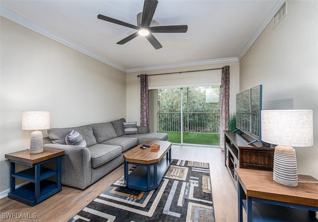 living room featuring light hardwood / wood-style floors, ceiling fan, and ornamental molding