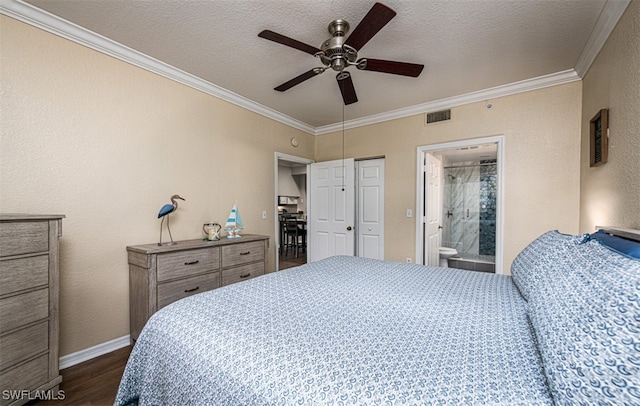 bedroom featuring ornamental molding, a textured ceiling, ceiling fan, dark wood-type flooring, and connected bathroom