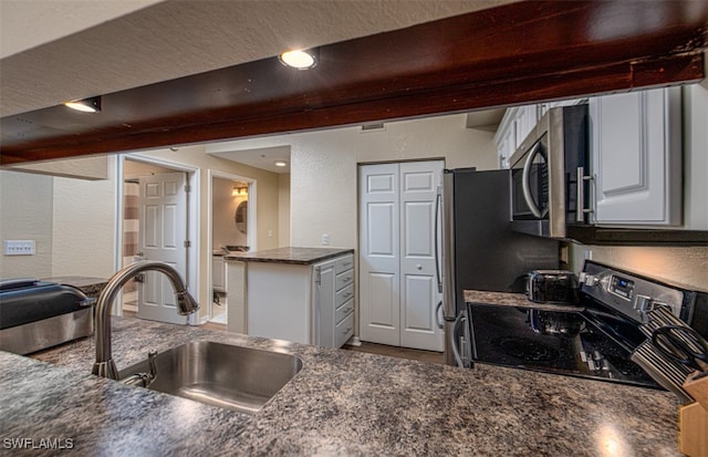 kitchen with white cabinetry, black electric range, and sink