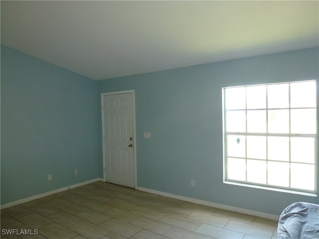 spare room featuring plenty of natural light