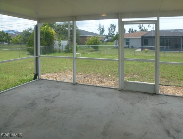 unfurnished sunroom featuring a wealth of natural light