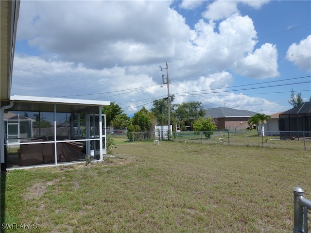 view of yard with a sunroom