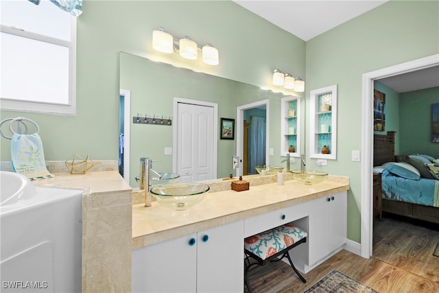 bathroom featuring hardwood / wood-style floors and vanity