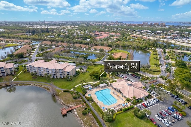 birds eye view of property with a water view