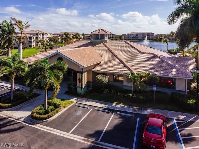 birds eye view of property with a water view