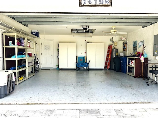 garage featuring ceiling fan and electric panel