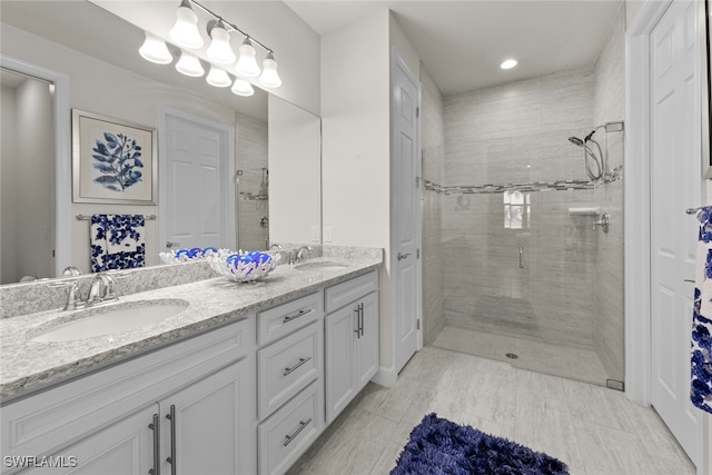 bathroom with an enclosed shower and vanity