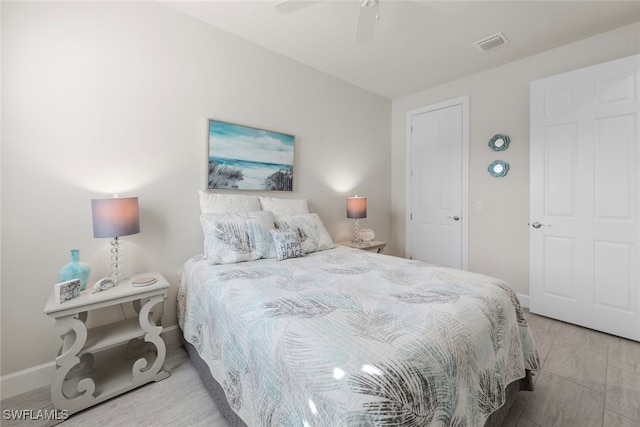 bedroom featuring light hardwood / wood-style flooring and ceiling fan