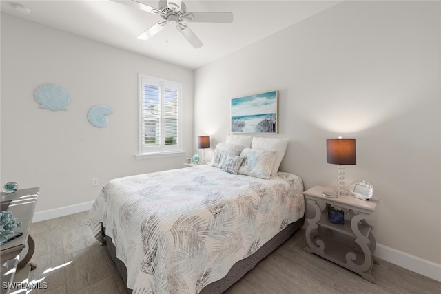 bedroom with hardwood / wood-style flooring and ceiling fan