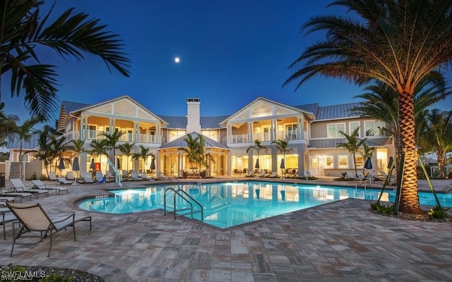 pool at night with a patio