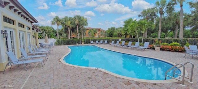 view of swimming pool featuring a patio area