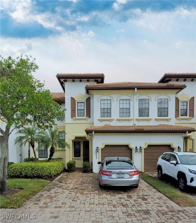 mediterranean / spanish-style house featuring a garage