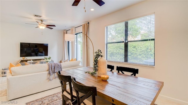 tiled dining room with ceiling fan